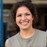 Hannah Rodriguez smiling outside auto repair shop